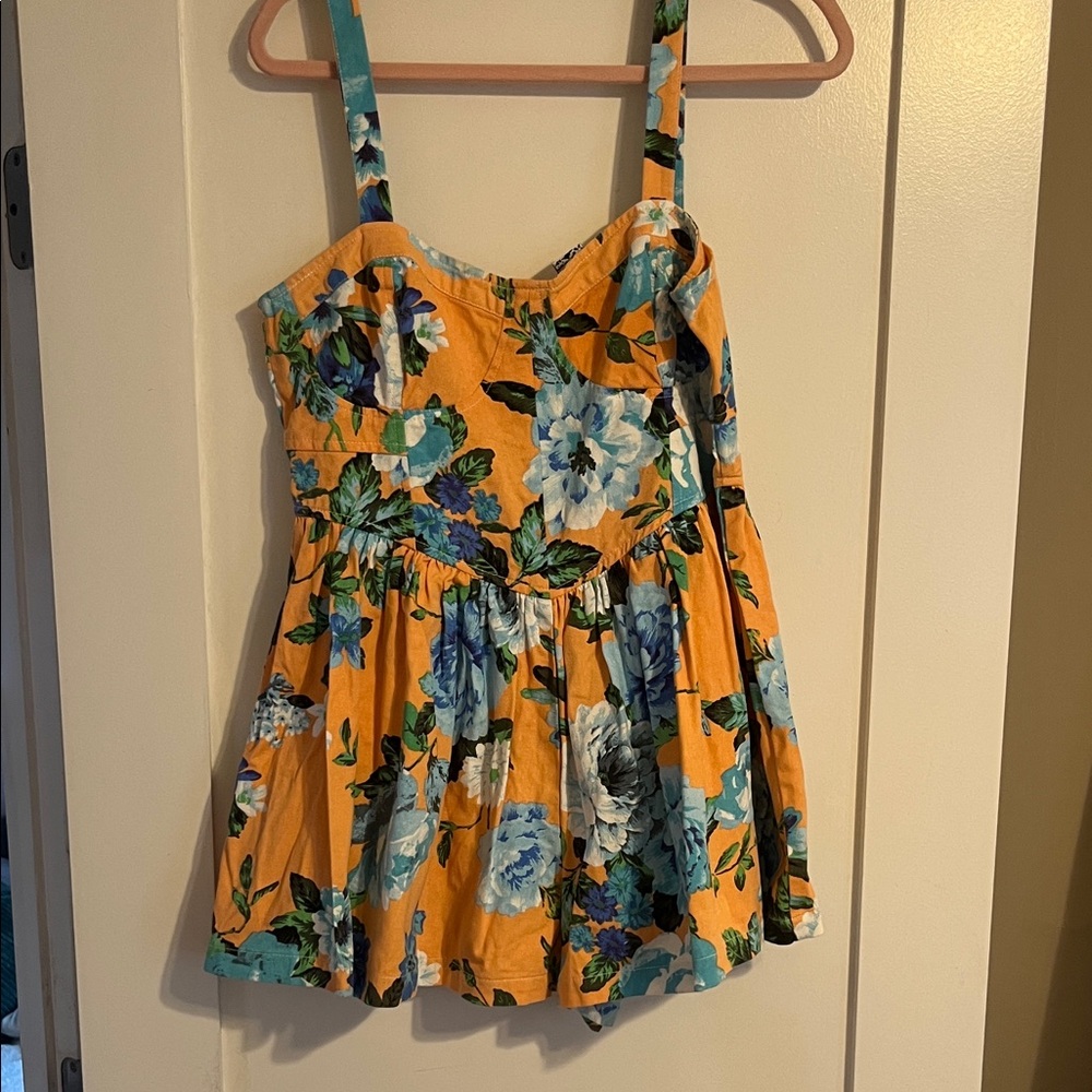 orange romper with Blue flowers